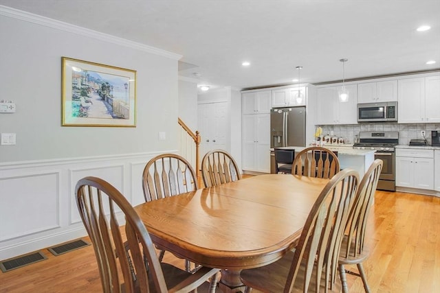 11 Bigelow Dr Unit 11, Berlin, MA 01503 - dining space with ornamental molding, light wood-type flooring, a decorative wall, wainscoting, and recessed lighting