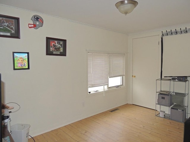 unfurnished office featuring light hardwood / wood-style floors