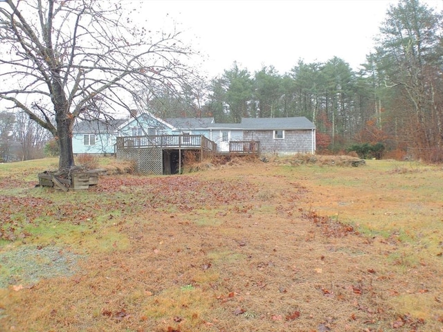 view of yard featuring a wooden deck