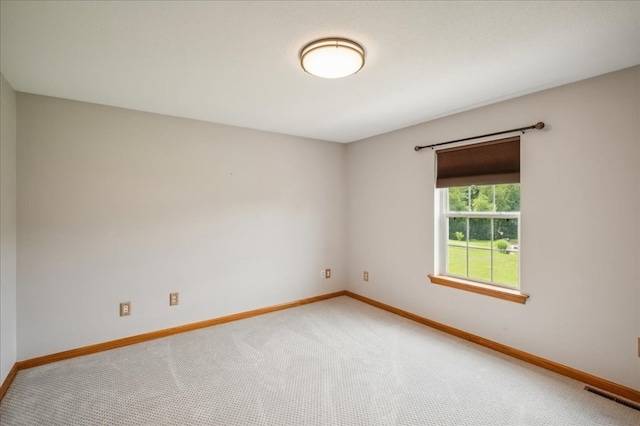 spare room featuring carpet floors