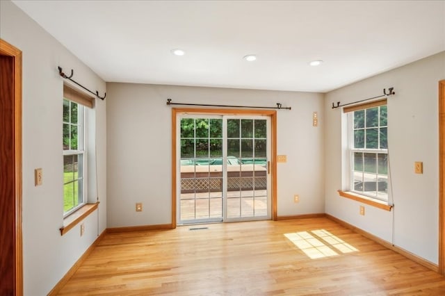 spare room with light wood-type flooring