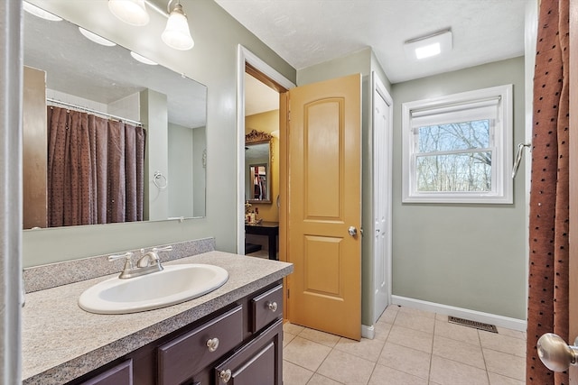 bathroom with vanity and tile patterned floors