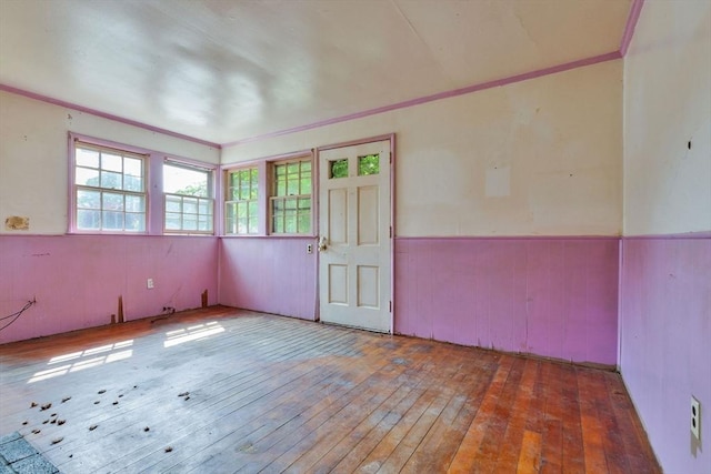 91 Baxter Rd, Barnstable, MA 02601 - spare room with ornamental molding, a wainscoted wall, and wood-type flooring