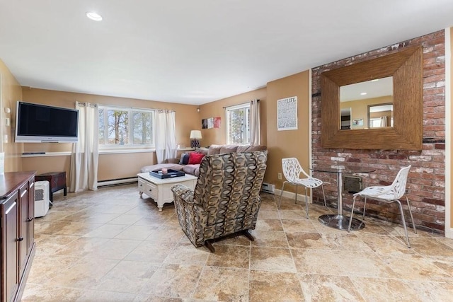 living area with recessed lighting, baseboards, and baseboard heating