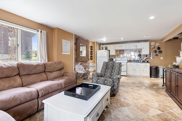 living room with recessed lighting and stone finish flooring
