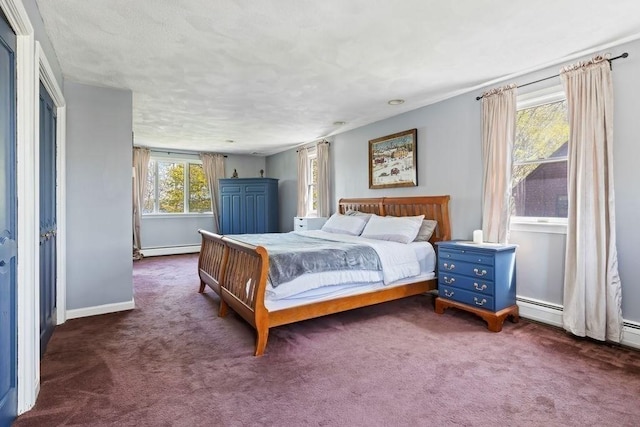 bedroom featuring baseboards, carpet flooring, and a baseboard heating unit