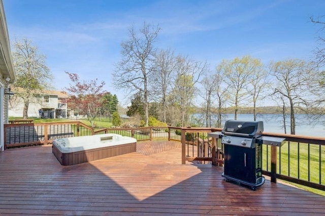 wooden terrace with a water view and grilling area