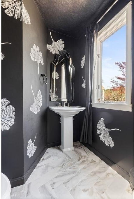 bathroom with marble finish floor