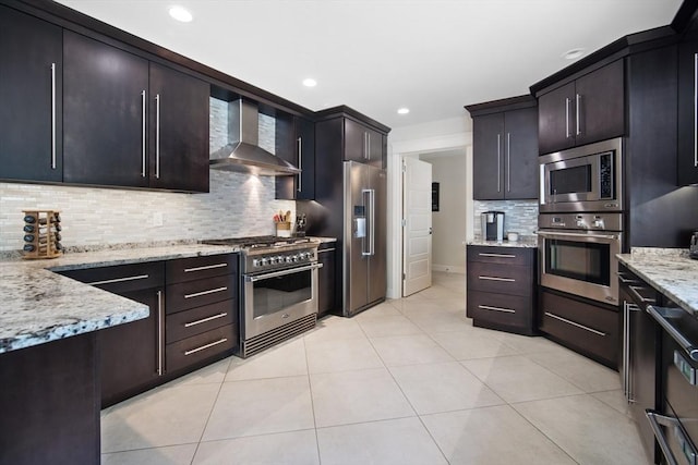 2 Nikkis Way, Hadley, MA 01035 - kitchen with high end appliances, wall chimney exhaust hood, backsplash, light stone counters, and light tile patterned flooring