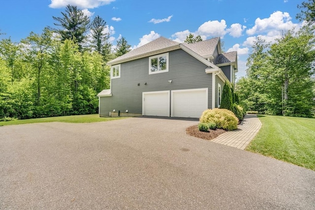 2 Nikkis Way, Hadley, MA 01035 - view of side of property with driveway, a yard, an attached garage, and a shingled roof