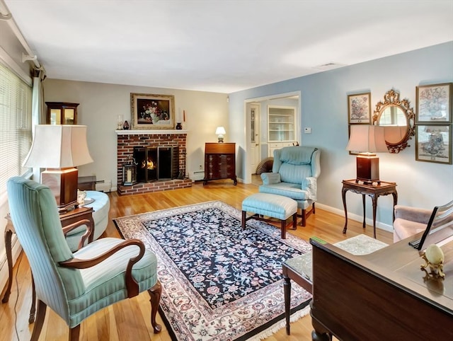 442 Purchase St, Easton, MA 02375 - living area featuring wood finished floors, baseboard heating, a fireplace, and baseboards