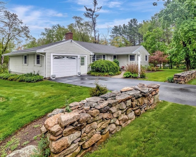 442 Purchase St, Easton, MA 02375 - ranch-style home with asphalt driveway, a chimney, a garage, and a front lawn