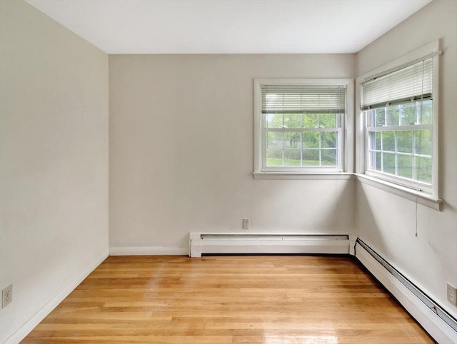 442 Purchase St, Easton, MA 02375 - empty room with baseboard heating, light wood-style flooring, and baseboards