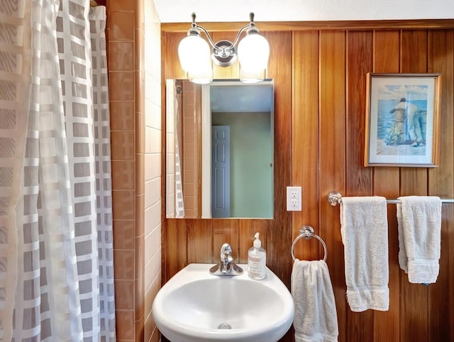 442 Purchase St, Easton, MA 02375 - full bath featuring a sink, a shower with curtain, and wood walls