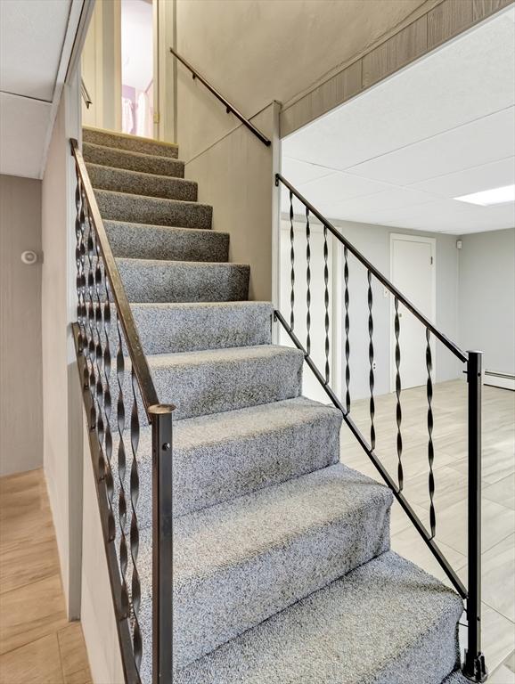 442 Purchase St, Easton, MA 02375 - staircase featuring a baseboard radiator
