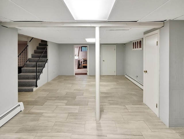 442 Purchase St, Easton, MA 02375 - finished basement with baseboard heating, stairs, and a paneled ceiling