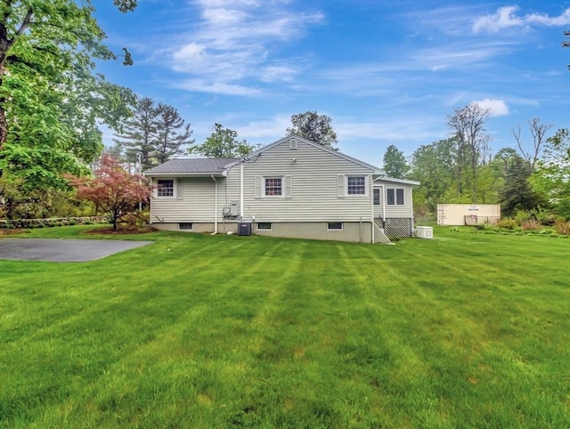 442 Purchase St, Easton, MA 02375 - rear view of house featuring a lawn