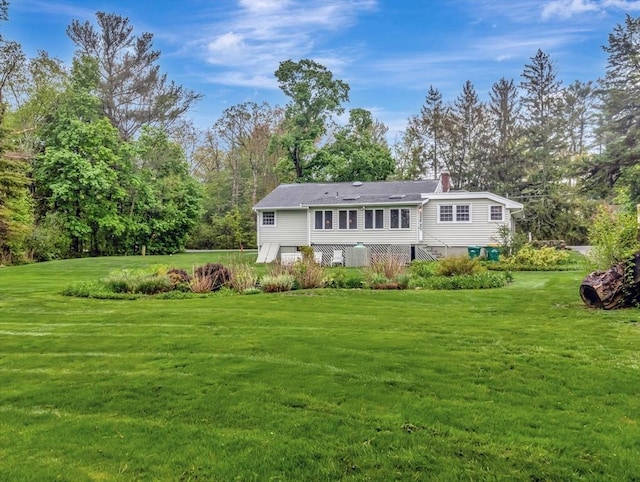442 Purchase St, Easton, MA 02375 - rear view of house featuring a chimney and a yard