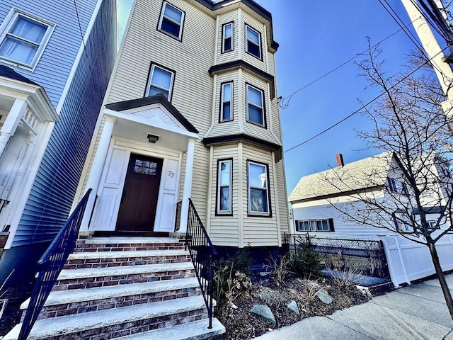 view of front of house with fence