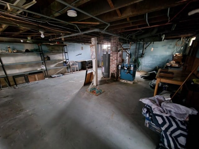 basement with gas water heater and heating unit