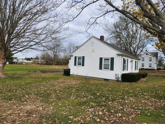 view of home's exterior with a lawn