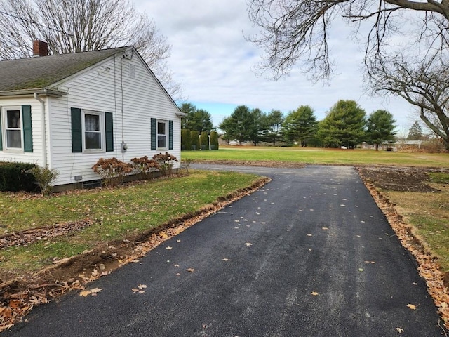 view of side of property featuring a yard