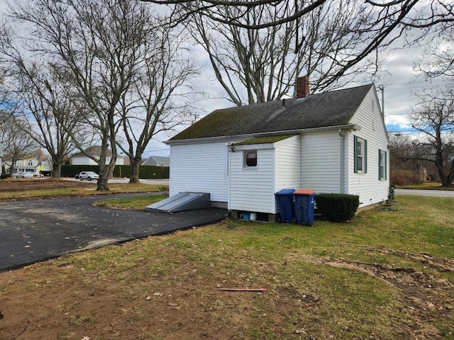 view of home's exterior featuring a yard