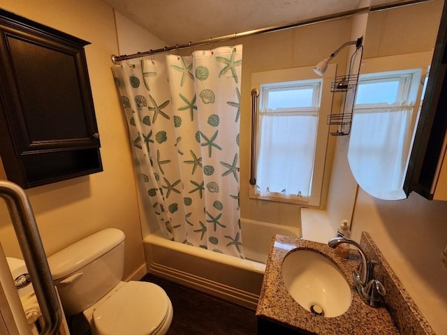 full bathroom featuring shower / bath combination with curtain, toilet, and vanity