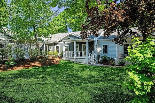 16 Green St Unit 11, Ipswich, MA 01938 - view of front of house featuring a front yard and covered porch