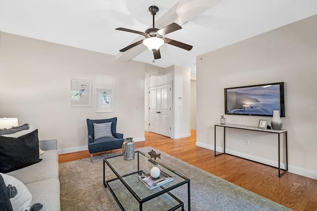 16 Green St Unit 11, Ipswich, MA 01938 - living area with wood finished floors, ceiling fan, and baseboards