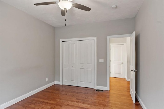 295 Sewall St Unit 295, Boylston, MA 01505 - unfurnished bedroom with light wood-type flooring, baseboards, a closet, and a ceiling fan