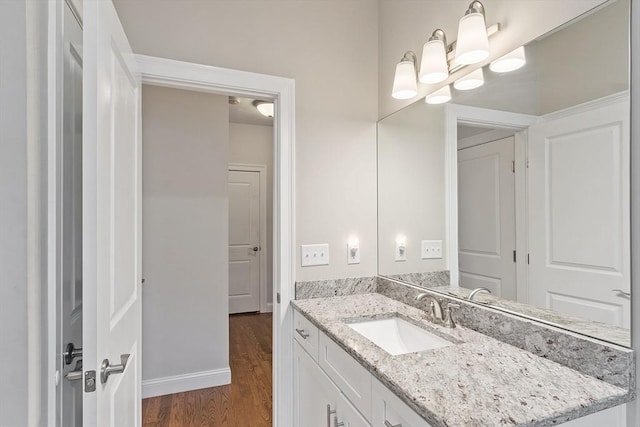 295 Sewall St Unit 295, Boylston, MA 01505 - bathroom with wood finished floors, vanity, and baseboards