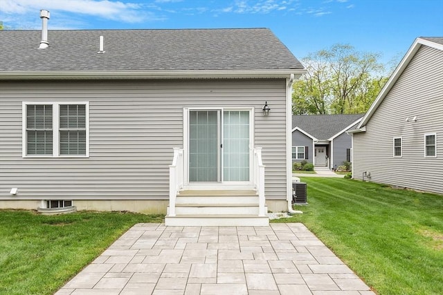 295 Sewall St Unit 295, Boylston, MA 01505 - back of house with entry steps, a yard, roof with shingles, central air condition unit, and a patio area