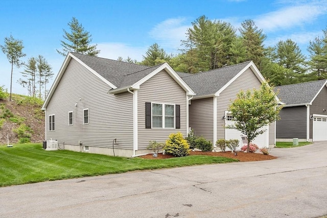 295 Sewall St Unit 295, Boylston, MA 01505 - view of front facade with driveway, a front yard, a garage, and roof with shingles