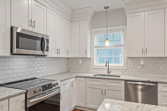 295 Sewall St Unit 295, Boylston, MA 01505 - kitchen featuring stainless steel appliances, a sink, white cabinets, decorative light fixtures, and backsplash