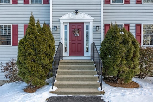 view of snow covered property entrance