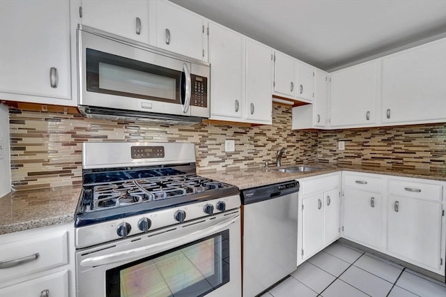 360 Littleton Unit D1, Chelmsford, MA 01824 - kitchen with appliances with stainless steel finishes, a sink, white cabinets, and light tile patterned floors