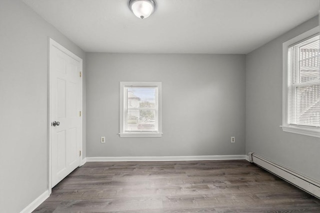 78-82 3rd St, Lowell, MA 01850 - unfurnished bedroom with a baseboard radiator and wood finished floors