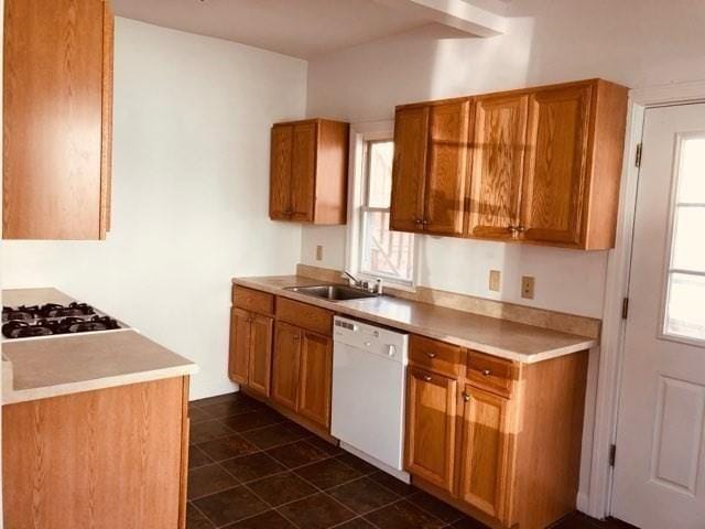 78-82 3rd St, Lowell, MA 01850 - kitchen with white appliances, brown cabinets, and light countertops