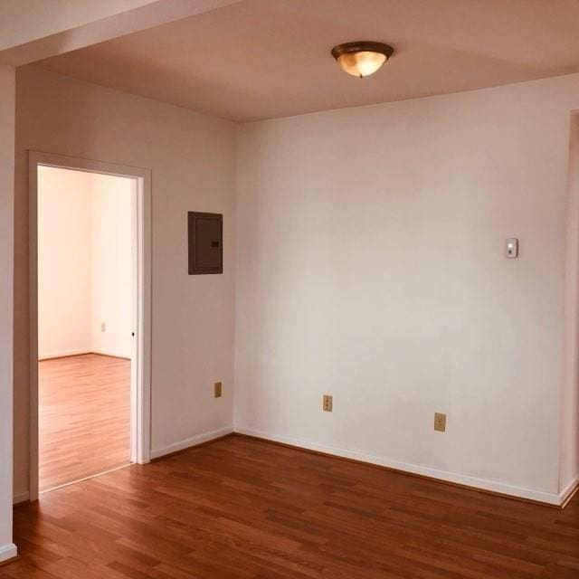 78-82 3rd St, Lowell, MA 01850 - spare room with wood finished floors and electric panel