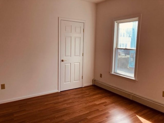 78-82 3rd St, Lowell, MA 01850 - unfurnished room with a baseboard heating unit, plenty of natural light, and wood finished floors