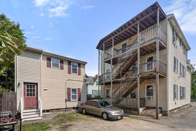 78-82 3rd St, Lowell, MA 01850 - rear view of property with stairs and entry steps