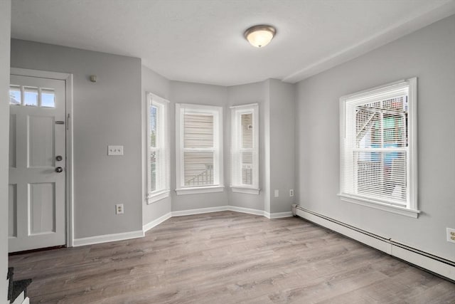 78-82 3rd St, Lowell, MA 01850 - foyer featuring a baseboard radiator and wood finished floors