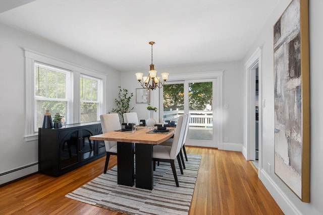 21 Ames, Lynn, MA 01905 - dining room with a chandelier, light wood-style flooring, and a baseboard radiator