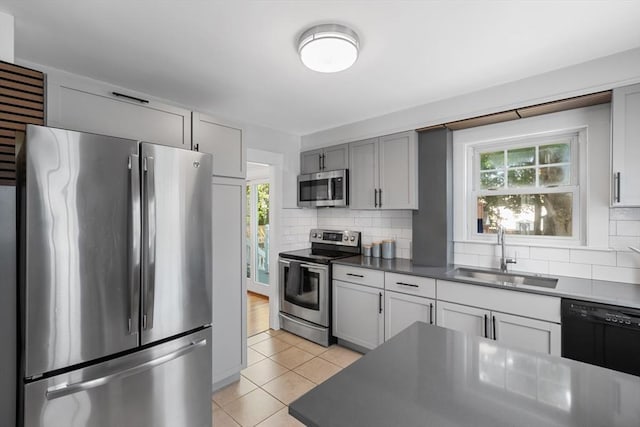 21 Ames, Lynn, MA 01905 - kitchen featuring stainless steel appliances, light tile patterned flooring, backsplash, and healthy amount of natural light