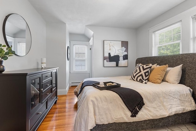 21 Ames, Lynn, MA 01905 - bedroom featuring light wood-type flooring and a baseboard radiator