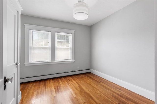 21 Ames, Lynn, MA 01905 - spare room with baseboard heating and light wood-style flooring