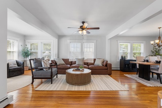 21 Ames, Lynn, MA 01905 - living area with a baseboard heating unit, wood finished floors, ceiling fan, and a chandelier