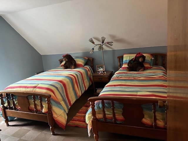 bedroom featuring vaulted ceiling and ceiling fan