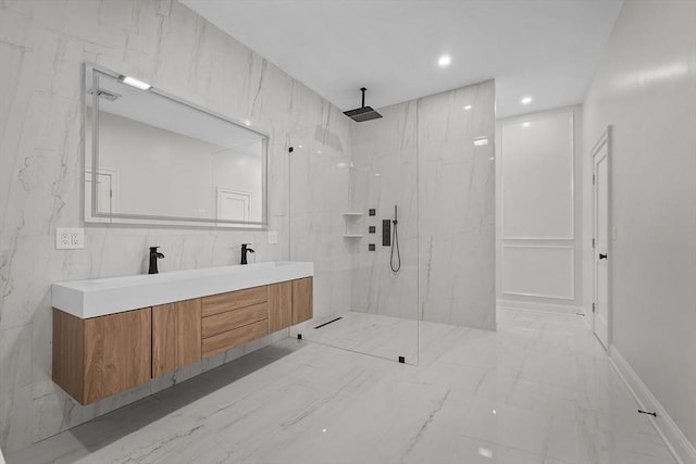 bathroom with vanity and a tile shower